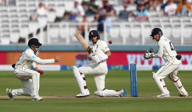 Joe Root of England sweeps past Tom Latham of New Zealand watched on by BJ Watling during Day 5 of the First LV= Insurance Test Match between England...