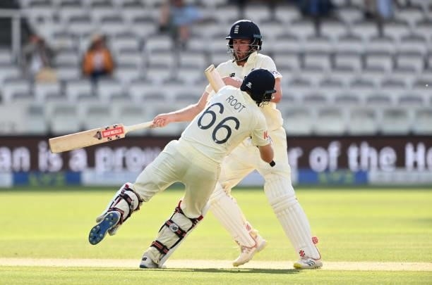 Joe Root of England collides with Dom Sibley as they take a run during Day 5 of the First LV= Insurance Test Match between England and New Zealand at...