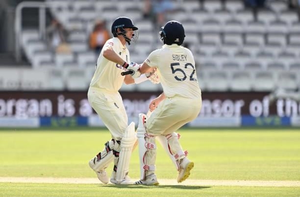 Joe Root of England collides with Dom Sibley as they take a run during Day 5 of the First LV= Insurance Test Match between England and New Zealand at...