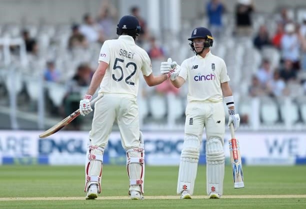 Dom Sibley of England celebrates reaching fifty with Ollie Pope during Day 5 of the First LV= Insurance Test Match between England and New Zealand at...