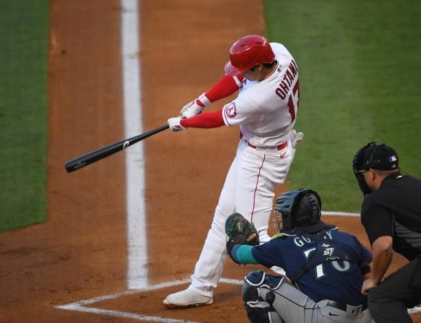 Shohei Ohtani of the Los Angeles Angels hits a solo home in the first inning of the game against the Seattle Mariners at Angel Stadium of Anaheim on...