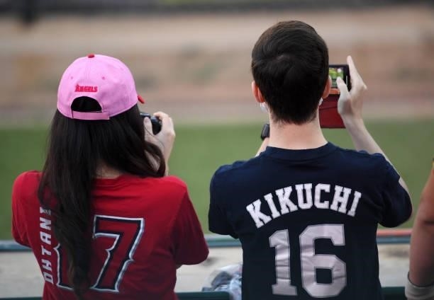 Fans of Shohei Ohtani of the Los Angeles Angels and Yusei Kikuchi of the Seattle Mariners attend the game at Angel Stadium of Anaheim on June 5, 2021...