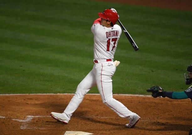 Shohei Ohtani of the Los Angeles Angels hits a RBI double in the game against the Seattle Mariners at Angel Stadium of Anaheim on June 5, 2021 in...