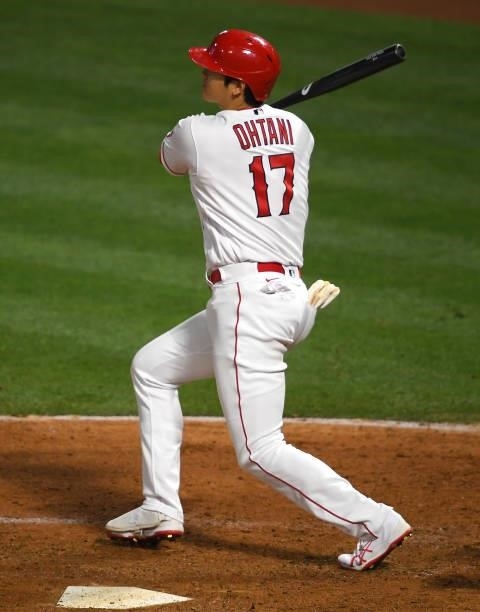 Shohei Ohtani of the Los Angeles Angels hits a RBI double in the game against the Seattle Mariners at Angel Stadium of Anaheim on June 5, 2021 in...