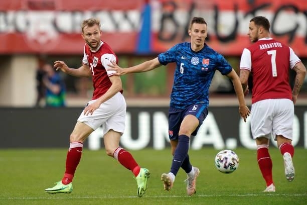 Jan Gregus of Slovakia battles for possession with Konrad Laimer of Austria during the international friendly match between Austria and Slovakia at...