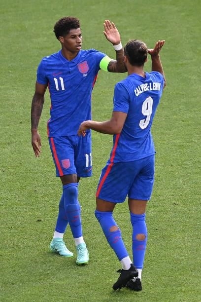 Marcus Rashford of England celebrates with Dominic Calvert-Lewin after scoring their side's first goal during the international friendly match...