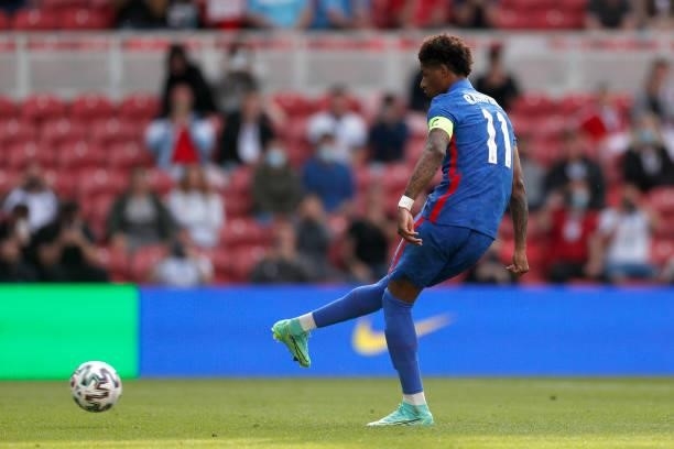 Marcus Rashford of England scores their side's first goal from the penalty spot during the international friendly match between England and Romania...