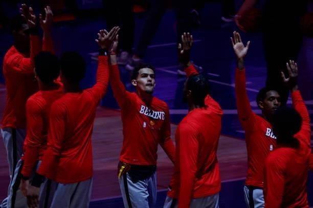 Trae Young of the Atlanta Hawks high fives teammates before playing against the Philadelphia 76ers during Game One of the Eastern Conference second...