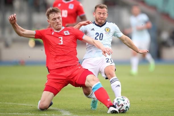 Ryan Fraser of Scotland battles for possession with Enes Mahmutovic of Luxembourg during the international friendly match between Luxembourg and...