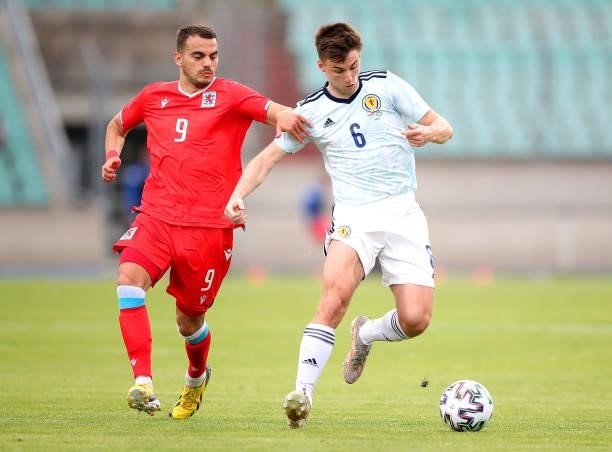 Kieran Tierney of Scotland is closed down by Danel Sinani of Luxembourg during the international friendly match between Luxembourg and Scotland at...
