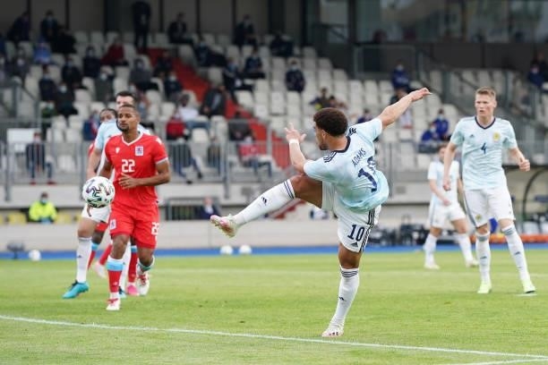 Che Adams of Scotland shoots during the international friendly match between Luxembourg and Scotland at Stade Josy Barthel on June 06, 2021 in...