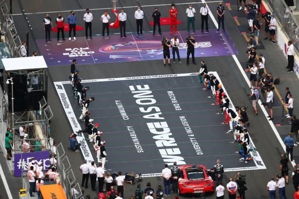 General view as the drivers stand and kneel in support of ending racism ahead of the F1 Grand Prix of Azerbaijan at Baku City Circuit on June 06,...