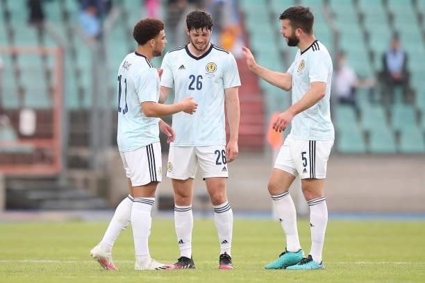 Che Adams, Scott McKenna and Grant Hanley of Scotland interact following the international friendly match between Luxembourg and Scotland at Stade...