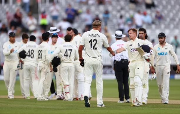 Kyle Jamieson of New Zealand shakes hands with Ollie Pope of England after Day 5 of the First LV= Insurance Test Match between England and New...