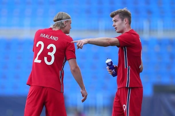 Erling Haaland of Norway speaks with team mate Patrick Berg during the International Friendly match between Norway and Greece at Estadio La Rosaleda...