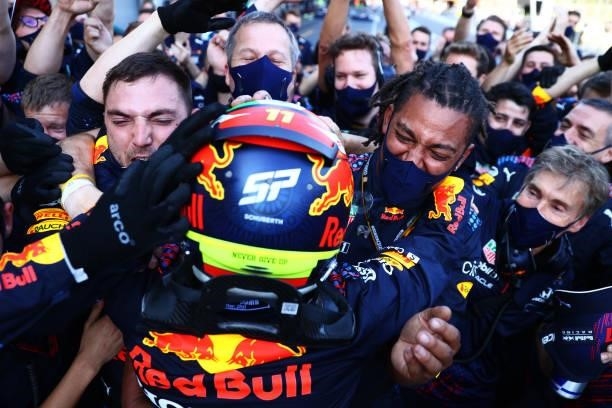 Race winner Sergio Perez of Mexico and Red Bull Racing celebrates with his team in parc ferme during the F1 Grand Prix of Azerbaijan at Baku City...