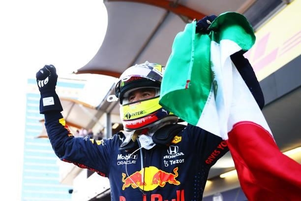 Race winner Sergio Perez of Mexico and Red Bull Racing celebrates in parc ferme during the F1 Grand Prix of Azerbaijan at Baku City Circuit on June...