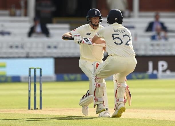 Joe Root collides with Dom Sibley of England during Day 5 of the First LV= Insurance Test match between England and New Zealand at Lord's Cricket...