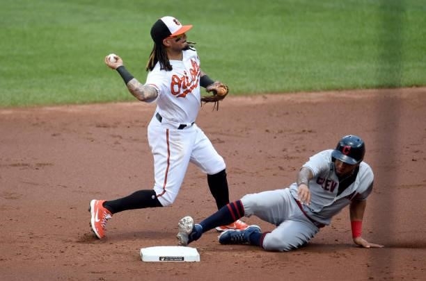 Freddy Galvis of the Baltimore Orioles forces out Eddie Rosario of the Cleveland Indians to start a double play in the second inning at Oriole Park...