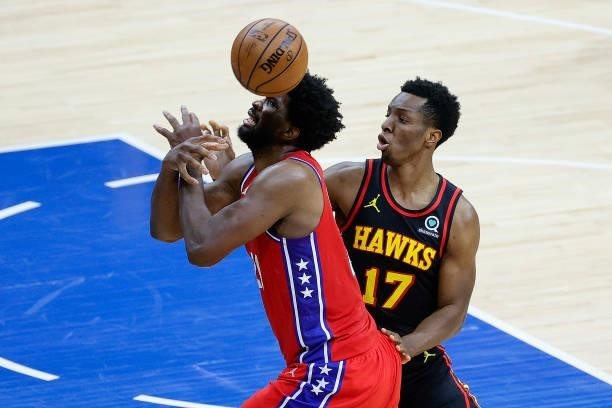 Joel Embiid of the Philadelphia 76ers is fouled by Onyeka Okongwu of the Atlanta Hawks during the second quarter during Game One of the Eastern...