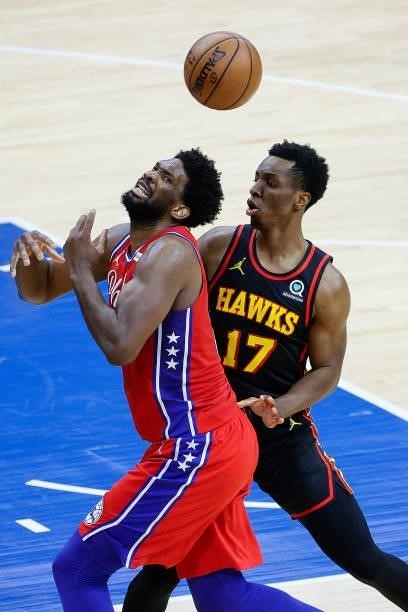 Joel Embiid of the Philadelphia 76ers is fouled by Onyeka Okongwu of the Atlanta Hawks during the second quarter during Game One of the Eastern...
