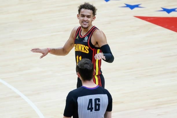 Trae Young of the Atlanta Hawks speaks with referee Ben Taylor during the second quarter during Game One of the Eastern Conference second round...