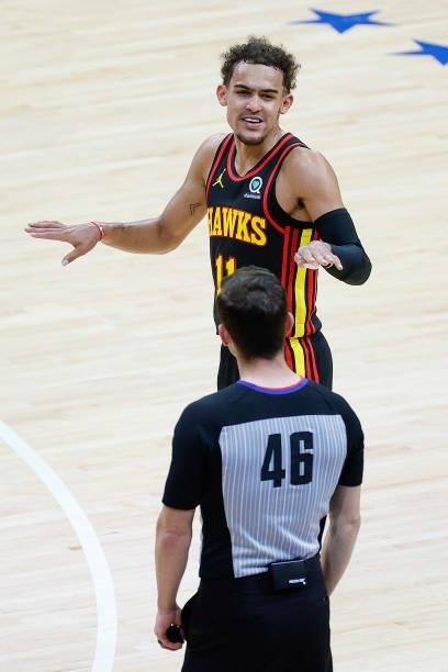 Trae Young of the Atlanta Hawks speaks with referee Ben Taylor during the second quarter during Game One of the Eastern Conference second round...