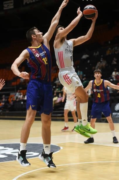 Matteo Spagnolo, #9 of U18 Real Madrid competes with Teodor Simic, #15 of FC Barcelona during the Adidas Next Generation Tournament Championship Game...