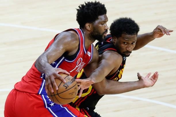 Solomon Hill of the Atlanta Hawks tries to steal the ball from Joel Embiid of the Philadelphia 76ers during the third quarter during Game One of the...