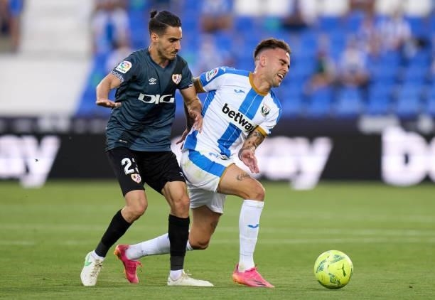 Roberto Ibañez of CD Leganes competes for the ball with Óscar Valentin Martin of Rayo Vallecano during the Liga Smartbank Playoffs match between CD...