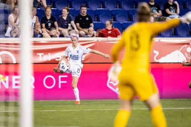 Megan Rapinoe of OL Reign stops the ball for the look at the goal during the second half of the match against NJ/NY Gotham FC at Red Bull Arena on...