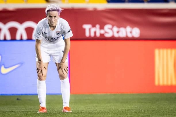 Megan Rapinoe of OL Reign with her hands on her knees watches the play during the second half of the match against NJ/NY Gotham FC at Red Bull Arena...