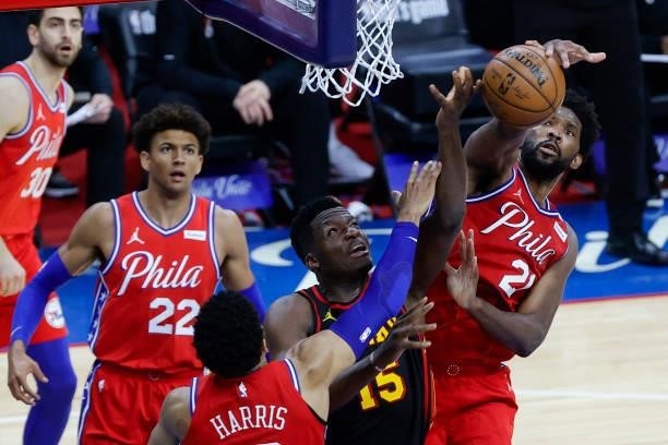 Joel Embiid of the Philadelphia 76ers blocks Clint Capela of the Atlanta Hawks during the third quarter during Game One of the Eastern Conference...