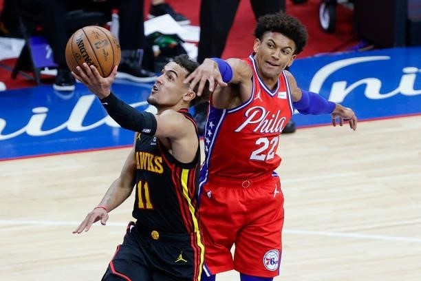 Trae Young of the Atlanta Hawks shoots under Matisse Thybulle of the Philadelphia 76ers during the fourth quarter during Game One of the Eastern...