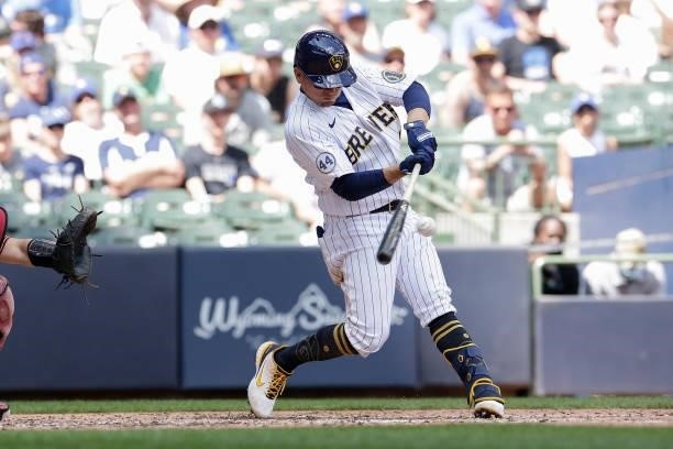 Luis Urias of the Milwaukee Brewers hits a double in the fifth inning against the Arizona Diamondbacks at American Family Field on June 06, 2021 in...