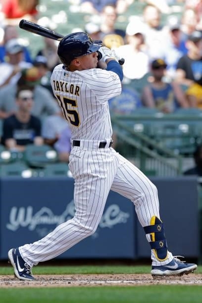 Tyrone Taylor of the Milwaukee Brewers hits a solo home run to left field in the sixth inning against the Arizona Diamondbacks at American Family...