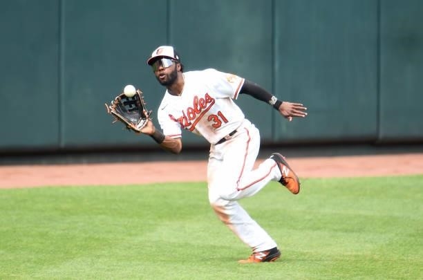 Cedric Mullins of the Baltimore Orioles catches a fly ball hit by Yu Chang of the Cleveland Indians in the sixth inning at Oriole Park at Camden...