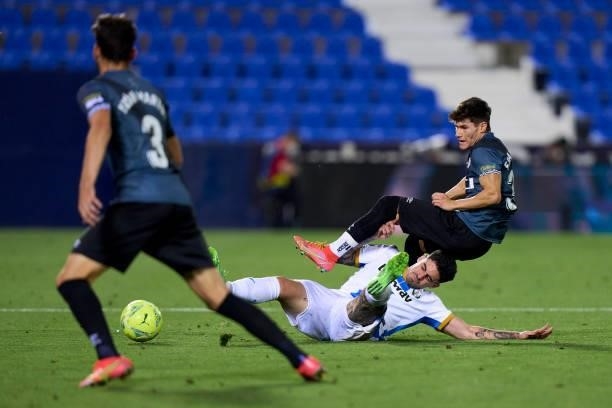 Miguel de la Fuente of Leganes battle for the ball with Fran Garcia of Rayo Vallecano during the Liga Smartbank Playoffs match between Leganes and...