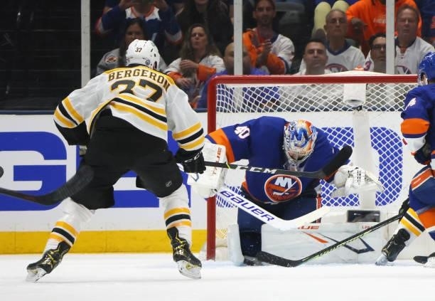 Patrice Bergeron of the Boston Bruins skates in on Semyon Varlamov of the New York Islanders in Game Four of the Second Round of the 2021 NHL Stanley...