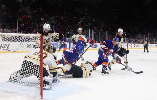 The Boston Bruins defend against the New York Islanders in Game Four of the Second Round of the 2021 NHL Stanley Cup Playoffs at the Nassau Coliseum...
