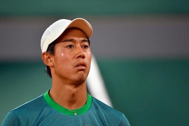 Kei Nishikori of Japan looks on during his Men's Singles fourth round match against Alexander Zverev of Germany on day eight of the 2021 French Open...