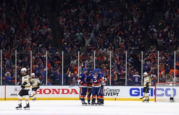 The New York Islanders celebrate an empty net goal against the Boston Bruins in Game Four of the Second Round of the 2021 NHL Stanley Cup Playoffs at...