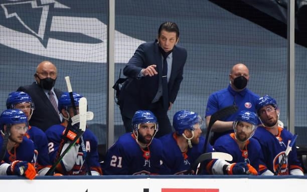 Assistant coach Lane Lambert of the New York Islanders handles instructions with his players during the third period against the Boston Bruins in...