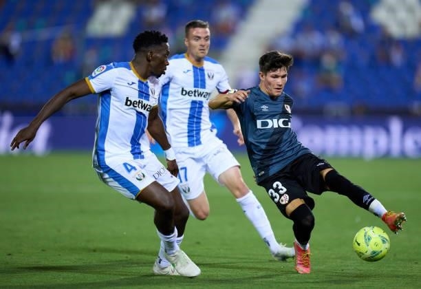 Fran Garcia of Rayo Vallecano is challenged by Kenneth Omeruo of CD Leganes during the Liga Smartbank Playoffs match between CD Leganes and Rayo...