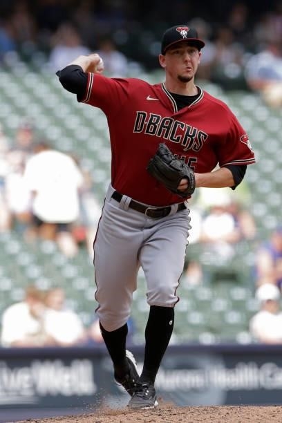 Taylor Clarke of the Arizona Diamondbacks throws over to first base in the seventh inning against the Milwaukee Brewers at American Family Field on...