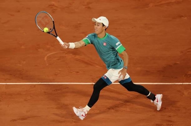 Kei Nishikori of Japan plays a forehand during his Men's Singles fourth round match against Alexander Zverev of Germany on day eight of the 2021...