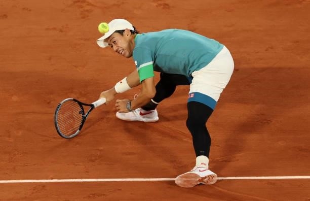 Kei Nishikori of Japan in action during his Men's Singles fourth round match against Alexander Zverev of Germany on day eight of the 2021 French Open...