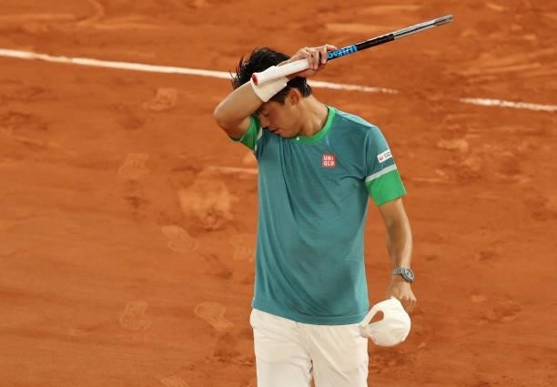 Kei Nishikori of Japan looks dejected after losing his Men's Singles fourth round match against Alexander Zverev of Germany on day eight of the 2021...