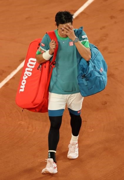 Kei Nishikori of Japan looks dejected as he walks off the court after losing his Men's Singles fourth round match against Alexander Zverev of Germany...