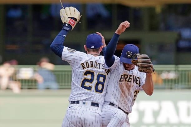 Willy Adames and Daniel Robertson of the Milwaukee Brewers celebrate a win against the Arizona Diamondbacks at American Family Field on June 06, 2021...